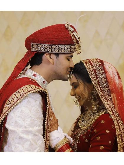 A sweet forehead kiss. A simple gesture that speaks volumes about their love and bond.