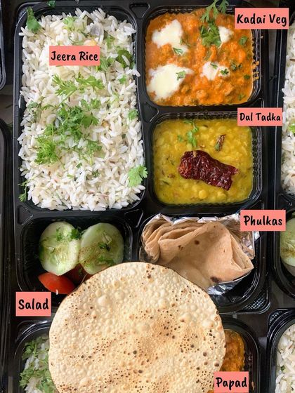 Another view of the comforting Jeera Rice and Dal Tadka meal box, a simple yet satisfying option for any lunch or dinner.