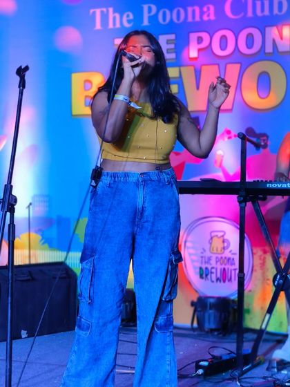 A full shot of the stage at The Poona Brewout. You can see the complete setup with keyboards, drums, and me on vocals, ready to deliver a powerful show.