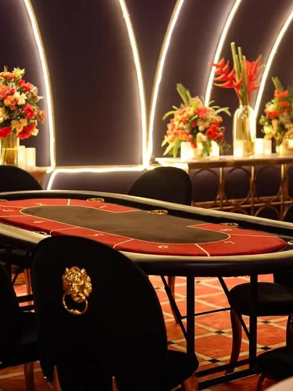 A close-up of one of the poker tables, ready for the night's games. The chairs with lion-head knockers added a touch of regal flair to the setup.