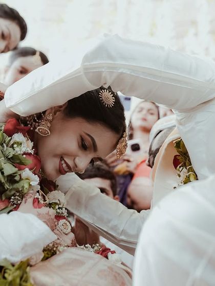 A close up view of a wedding ritual, showing the couple's hands and the genuine smiles exchanged. It’s these unposed, traditional moments that I love to document.
