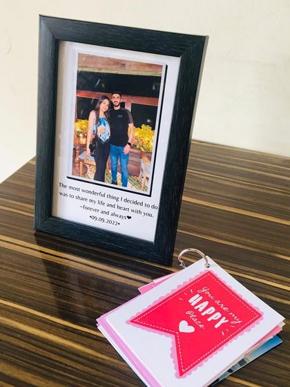 A perfect little combo gift. This set includes a framed photo with a custom message and a mini tag album filled with more of your favorite pictures.