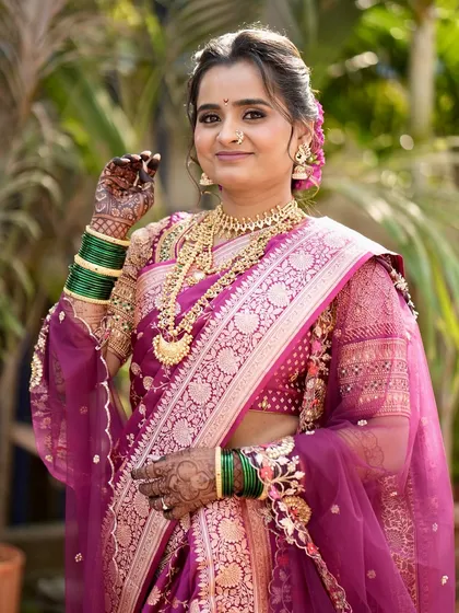 A full-length shot of Meghana in her gorgeous purple Paithani, showcasing the complete marathmola look.