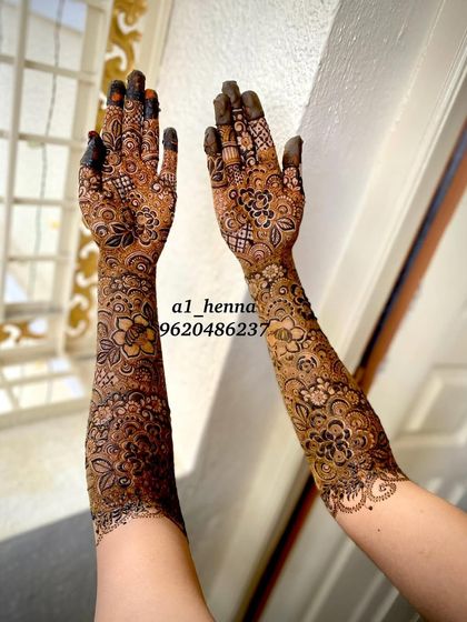 A complete view of Arfa's stunning bridal arms, showcasing the symmetry and complexity of the design.