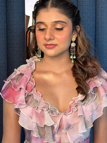 A close-up showing the soft, shimmery eyeshadow and glowing skin. This look is all about enhancing natural beauty with a touch of radiance.