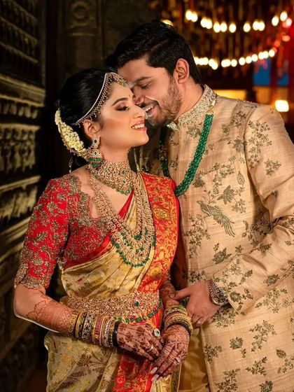 A romantic portrait of the couple, with the bride's stained hands adding to her stunning bridal ensemble.