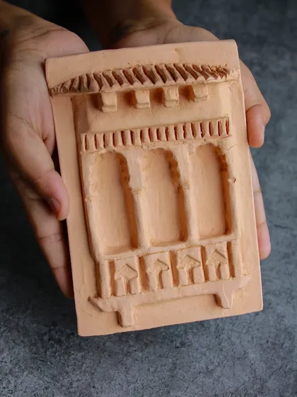 A student's work from our relief tile workshop, showcasing a beautiful architectural design. Participants can choose from our designs or bring their own.