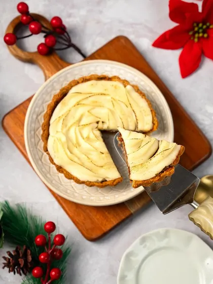 A slice of our Braised Lamb Shepherd's Tart, a savory and rich dish perfect for a festive meal. The tender lamb is topped with beautifully piped mashed potatoes.