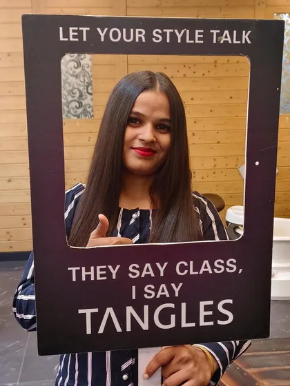 A happy client after her Kerasmooth treatment. Her hair is now frizz-free, smooth, and has a healthy shine, making her daily styling routine much simpler.