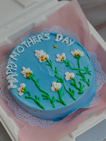 This hand-painted floral bento cake was one of our most popular items for Mother's Day. It's a small but beautiful way to show your appreciation.