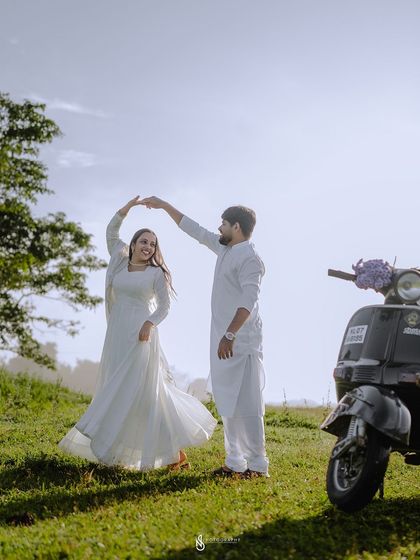 A beautiful dancing pose in the golden sunlight. This image is full of movement, joy, and romance.