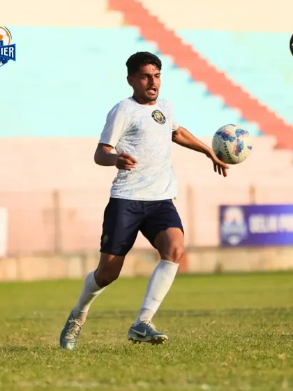 A player prepares to receive a pass, showing good movement and awareness.