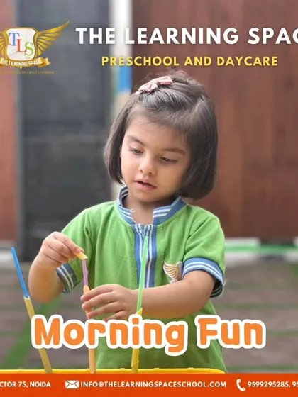 A focused young learner during morning fun. The concentration required for these activities helps improve attention span and cognitive skills.