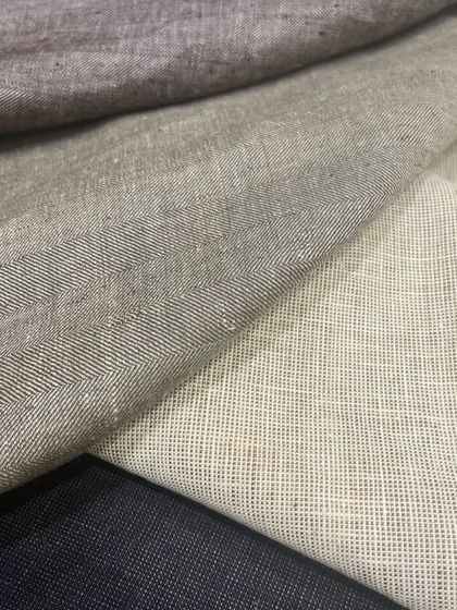 Our linen suiting fabrics come in a range of neutral and classic shades, perfect for timeless and versatile garments.
