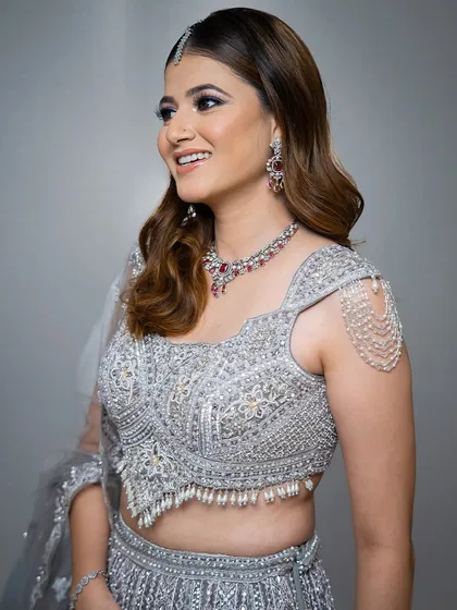 A side profile showing the delicate shoulder chain and matching earrings. It's these unique details that make my collection stand out.