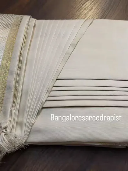 This is my signature box folding service, perfect for an engagement saree. The pleats are set and steam-pressed, and the saree is folded compactly, making it easy to store and ready to wear. This method protects the fabric and the pleats, whether you are storing it at home or traveling for a destination wedding.