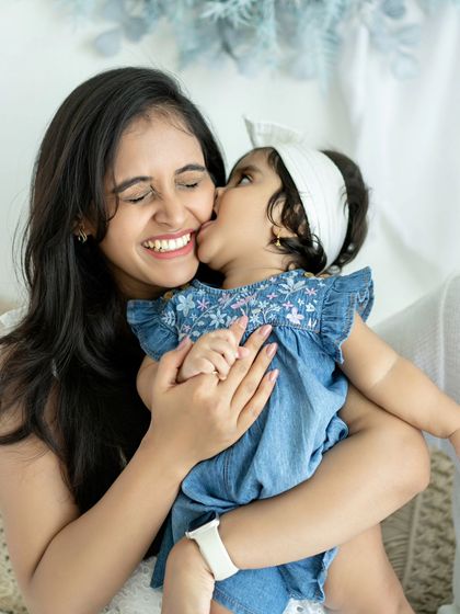 Another angle of this sweet mother-daughter kiss. I love capturing these moments from different perspectives to tell a complete story.