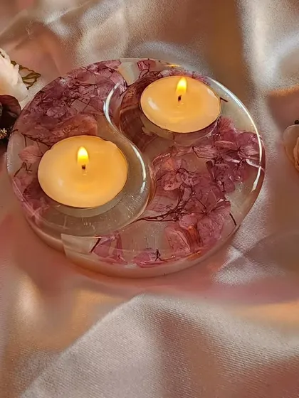 This yin-yang style tealight candle holder is one of my most popular items, especially for gifting. I made this one with delicate pink flowers preserved in clear and pearl-white resin. It creates such a warm and peaceful glow when the candles are lit.
