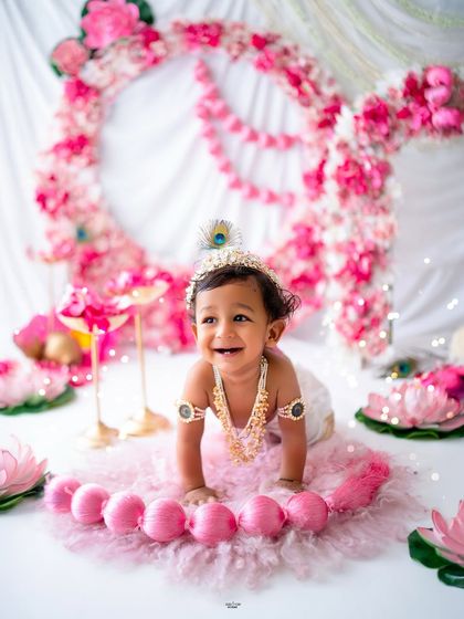 A crawling little Krishna with the biggest, happiest smile!