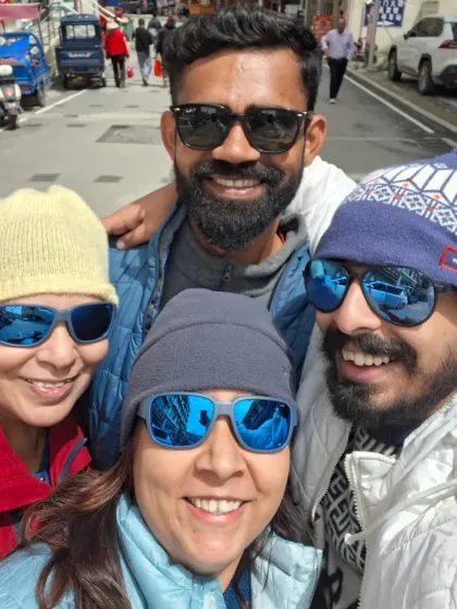 A happy moment with fellow travelers in Nyalam. The shared smiles and experiences build a strong bond within our group.