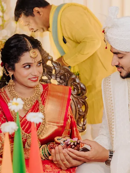 A happy, candid moment with her groom. Her makeup is designed to look radiant and natural, capturing her joy perfectly.