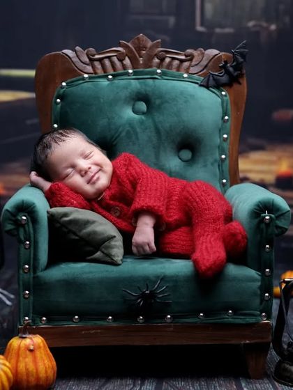 A happy little pumpkin. We were thrilled to capture this amazing smile during a Halloween-themed session, making it an extra special memory.