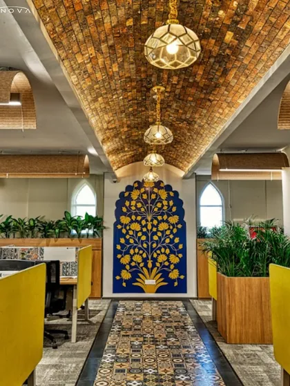 At the Miles Education office, I executed a design that blends rich Indian tradition with modern functionality. This view showcases the vaulted brick ceiling, intricate floor tiles, and custom "tree of life" wall art, all working together to create an inspiring atmosphere for learning.