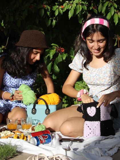 A typical scene for me: a picnic blanket covered in yarn, snacks, and works-in-progress. I’m dedicated to bringing you unique, handmade treasures.