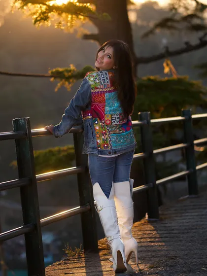 Taking fusion style on the road. I styled this denim jacket, which features a colorful ethnic patchwork back, with simple jeans and statement white boots for a cool and comfortable travel look.