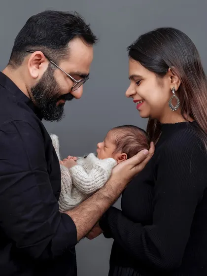 Those first few days are so precious and fleeting. I specialize in newborn photography that focuses on the tender connection between you and your baby. This studio portrait captures the quiet, overwhelming love of becoming new parents.
