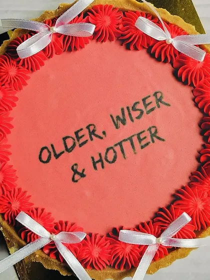 This angle highlights the glossy finish of the tart and the neat arrangement of the decorative ribbons. It’s a dessert that’s as fun to look at as it is to eat.