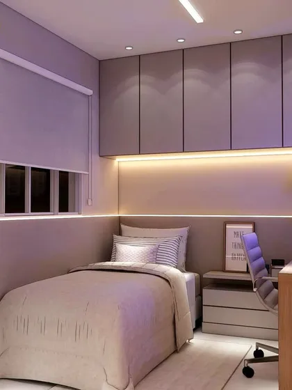 A view from the study desk towards the bed, showing the calm and functional layout of this compact room.