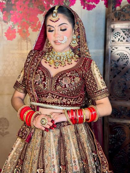 A soft, elegant pose. The makeup is glamorous yet sophisticated, a style that many modern brides prefer.