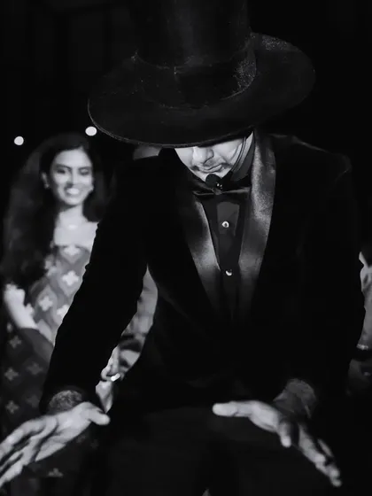 An artistic, black and white shot capturing the mysterious and theatrical mood of the custom-themed performance for Jo Malone.