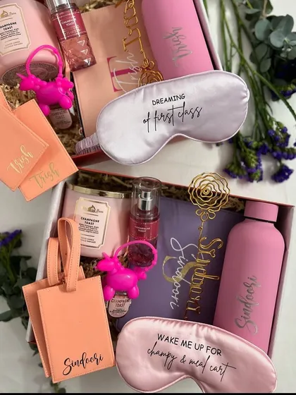 Dreaming of first class. Our bachelorette hampers are curated to pamper your bridesmaids, with items like personalised eye masks, luggage tags, and water bottles.