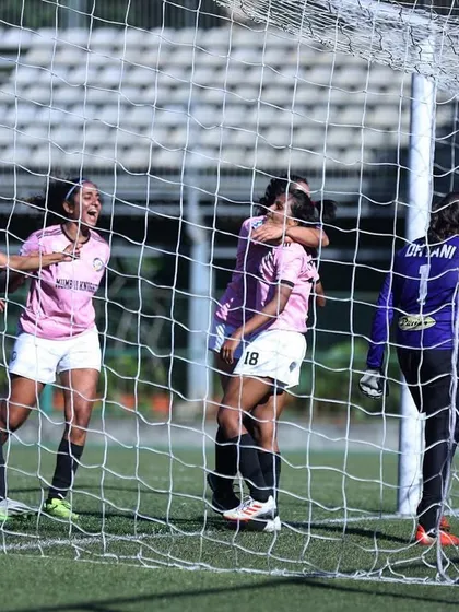 A goalmouth scramble, with our players celebrating as the ball hits the back of the net.