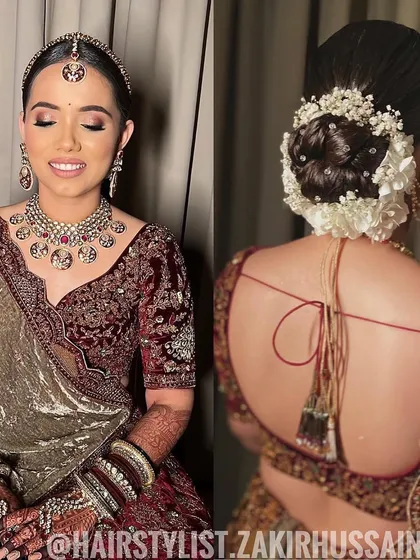 A classic bridal bun featuring a combination of white flowers and baby's breath. This style is perfect for a traditional wedding ceremony, providing a secure base for a veil or dupatta.