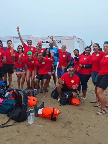 This is our adult squad, the Jellies, celebrating after a race. We're a tight-knit group of triathletes, open-water lovers, and Masters swimmers who train hard and have a lot of fun doing it.