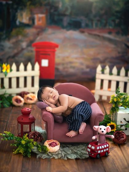 A different perspective of the village scene, with a tiny red bus prop adding a pop of color and whimsy to the sleepy setting.