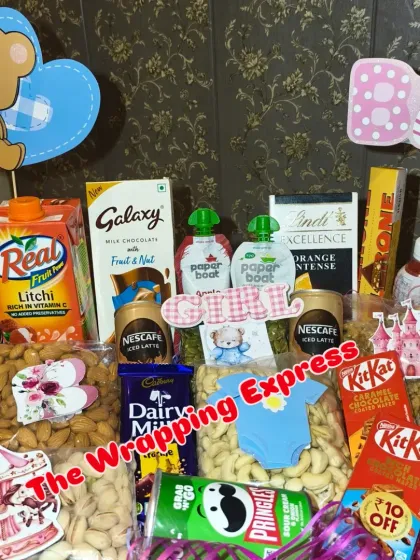 A closer view of the celebration hamper, showing the variety of treats like KitKat, Dairy Milk, and Toblerone.