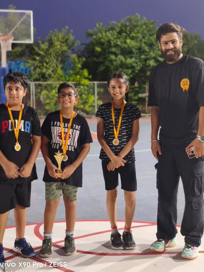 The team stands proudly with their medals and trophy after the U-10 FireBall tournament. This is a memory they will cherish and build upon.