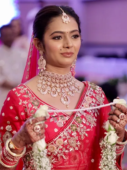 A candid moment during the wedding ceremony. The makeup is designed to be long-lasting and photograph beautifully, ensuring the bride looks fresh and radiant from the vows to the reception.