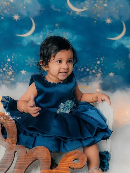 A twinkle in her eyes and mischief in her smile. This little girl is one year old and full of personality.