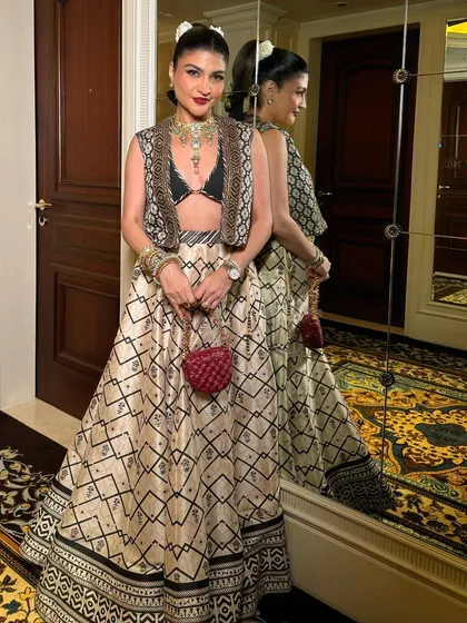 The full look, showcasing the unique JJ Valaya ensemble. The makeup is bold and confident, a perfect match for the modern, bohemian-inspired outfit.