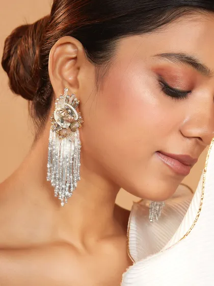 These shell and silver bead danglers are perfect for a destination wedding, blending natural elements with glamour.