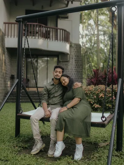 A quiet moment of rest and affection on a garden swing. This peaceful shot from their resort pre-wedding shoot is full of warmth and comfort.