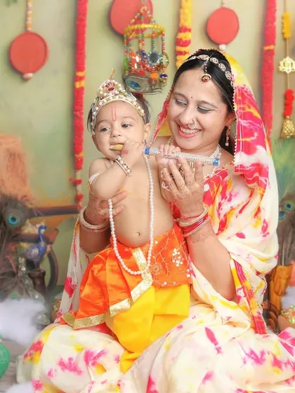 The bond between a mother and her child is the heart of these sessions. A sweet moment from a 'Krishna with Maiya' shoot.