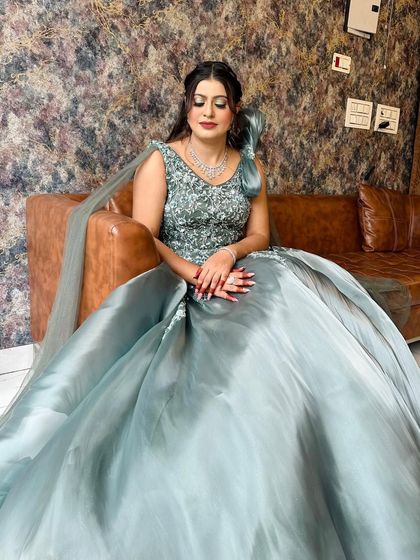 My engagement bride Chandani looking like she's out of a fairytale. Her sea-green ball gown is paired with soft, glamorous makeup.