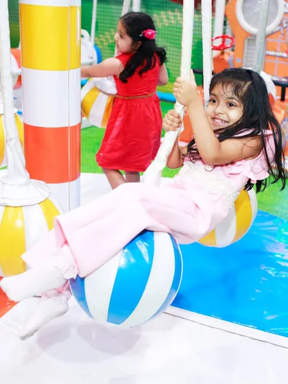 Swinging into fun! Our ball swings are a gentle and enjoyable ride for toddlers, helping them with balance in a secure setting.