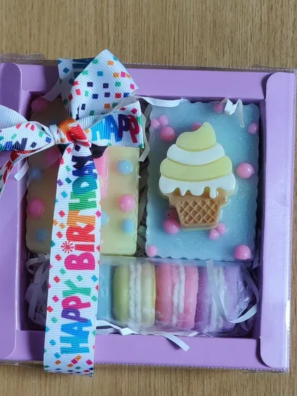 The ice cream and macaron soap set, wrapped with a "Happy Birthday" ribbon.
